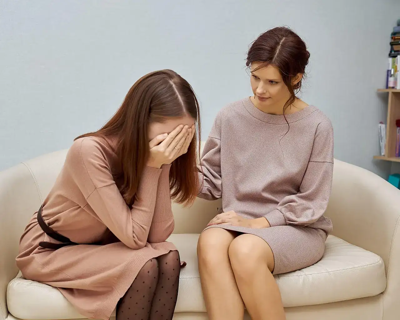 A therapist and client talking in a counseling session